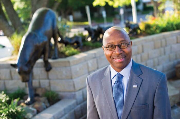 Derryle Peace background tiger cub statue