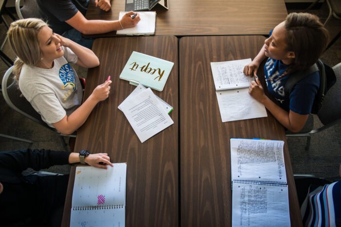 Students studying and having a conversation.