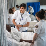 Two nursing students in the simulation lab.