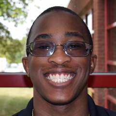 Henry smiling for his headshot