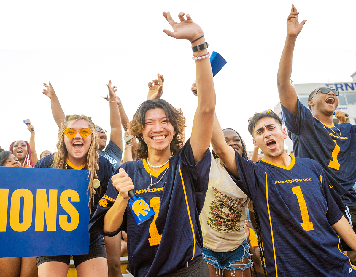 Spirited students cheering at the football stadium