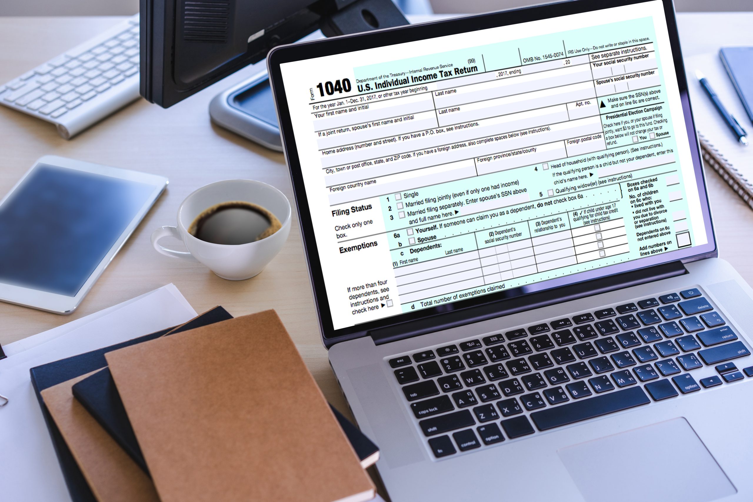 A computer with a W-2 tax return form on it.