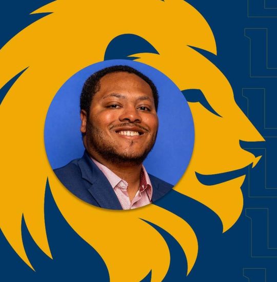 In a headshot photo, Tre' Johnson smiles for the camera.