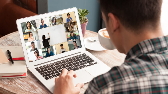 A person taking an online course on a laptop.