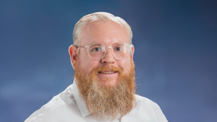 A headshot photo of a person.