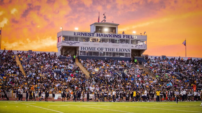 A photo of a college football stadium during a game.