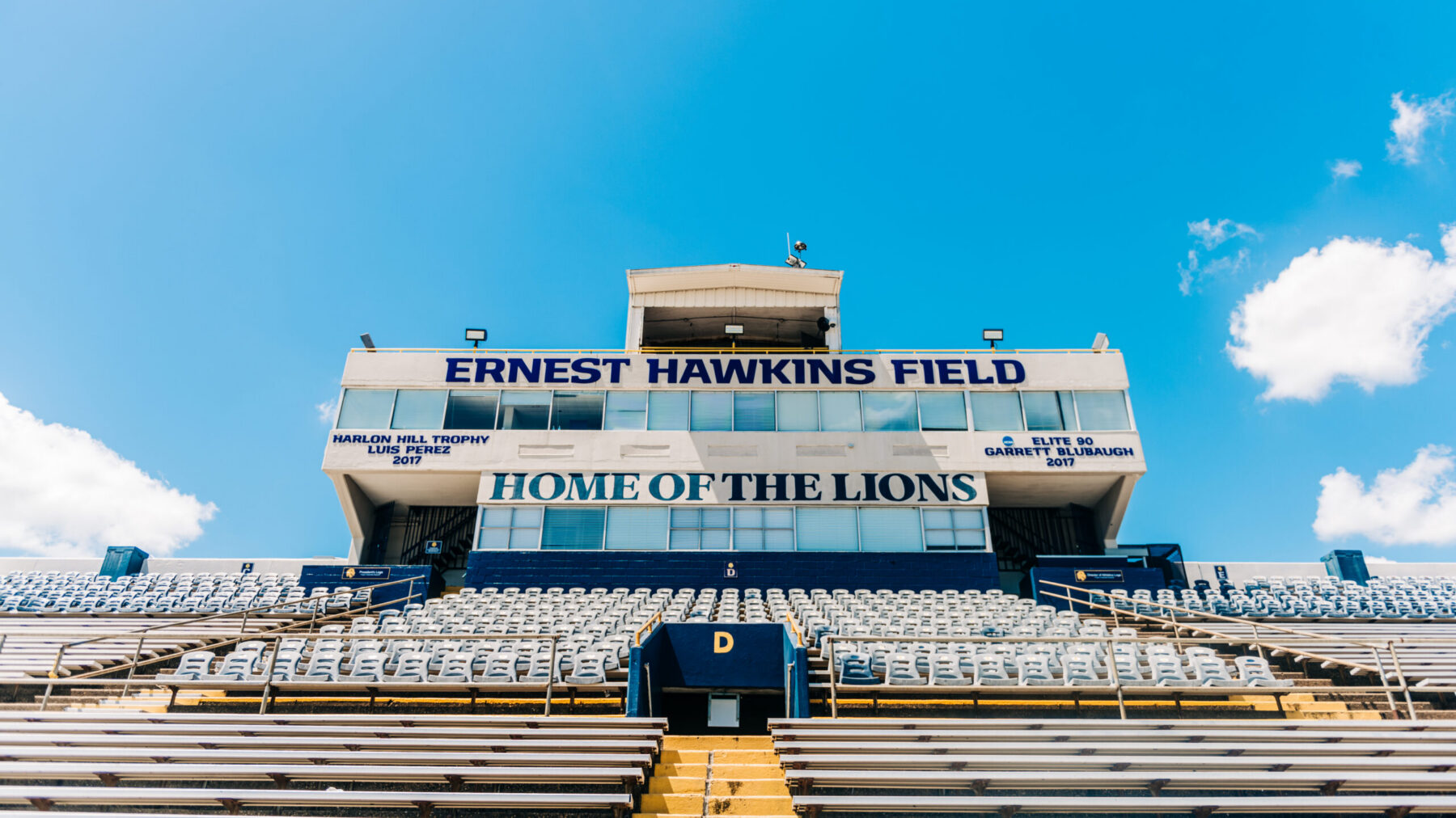 A photo of a college football stadium on a sunny day.